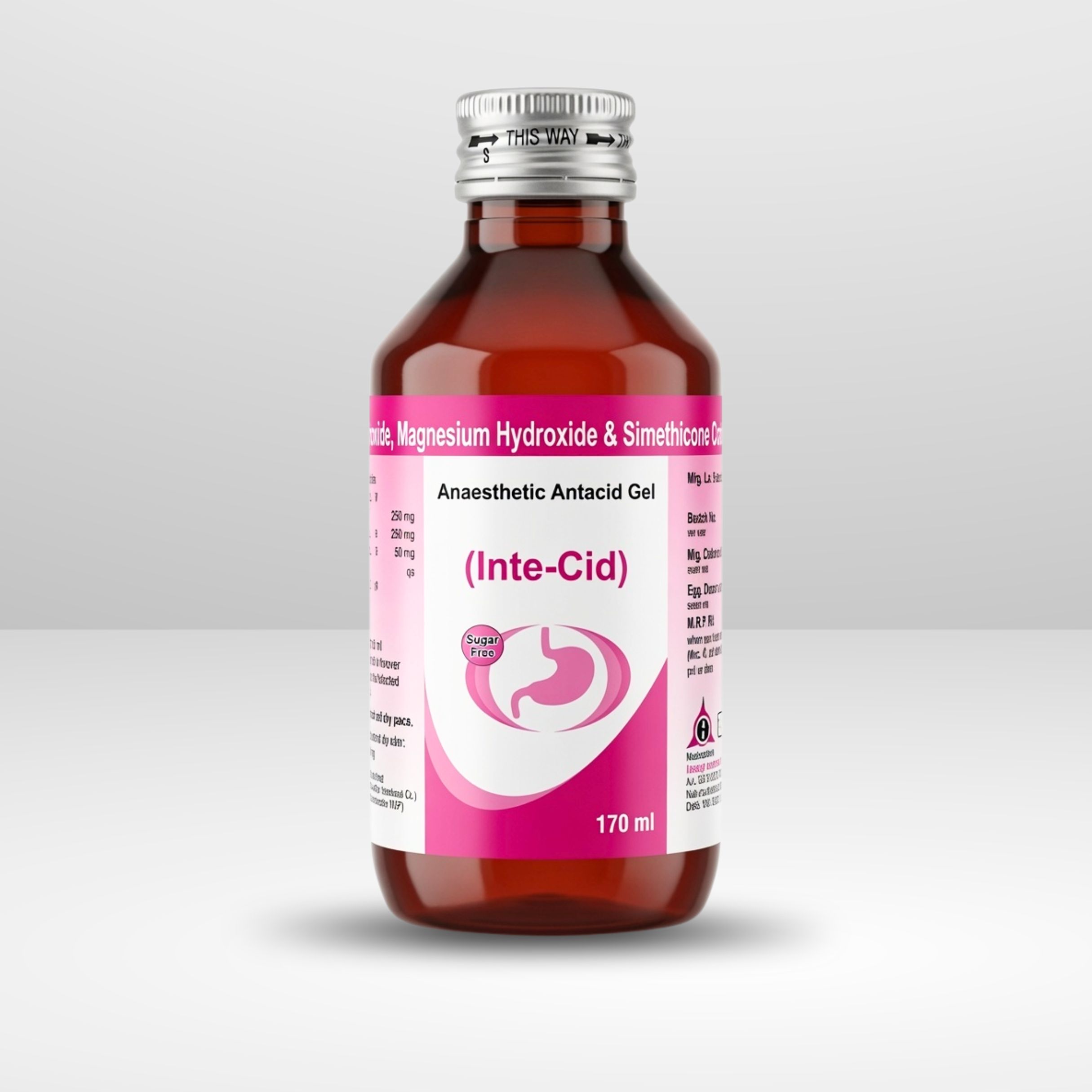 An amber medicine bottle of Inte-cid antacid liquid suspension standing next to its branded cardboard box with a measuring cap on top.
